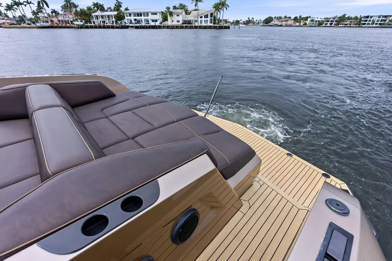 Cobra Yacht Photos Pics 2022 Vanquish Yachts VQ45 luxury yacht with sleek deck and waterfront view.