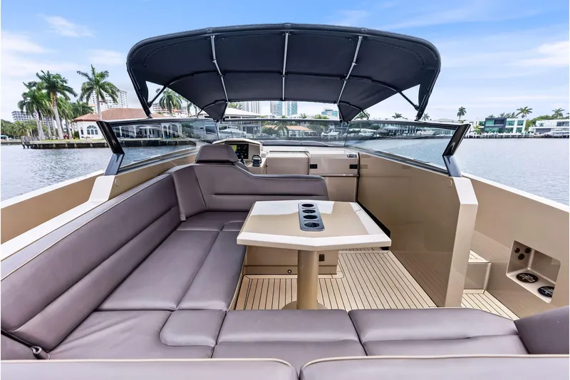 Cobra Yacht Photos Pics Luxurious 2022 Vanquish Yachts VQ45 interior with sleek seating and modern design.
