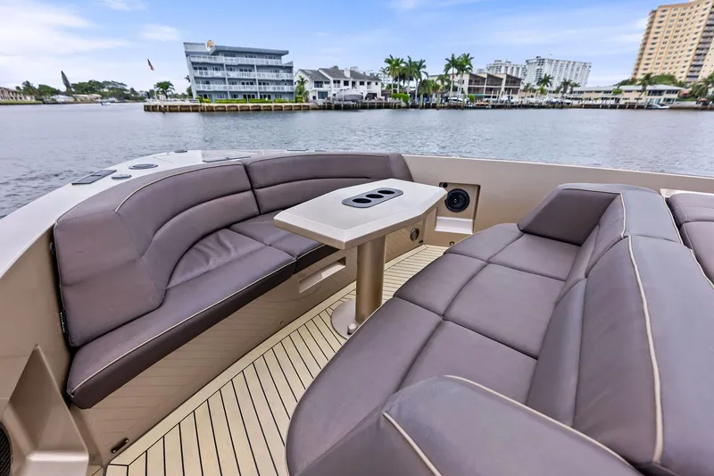 Cobra Yacht Photos Pics Luxurious seating area on 2022 Vanquish Yachts VQ45, with waterfront view.