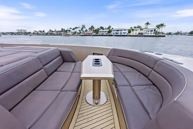 Cobra Yacht Photos Pics Luxurious seating area on 2022 Vanquish Yachts VQ45 with waterfront view.