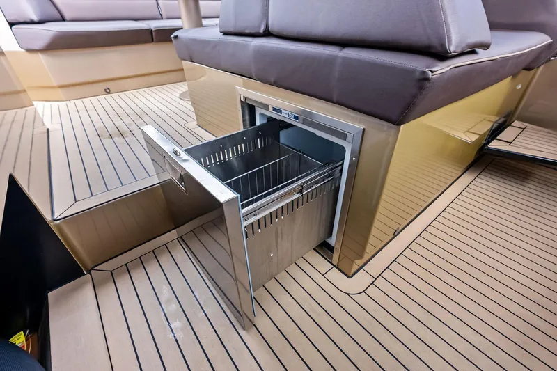 Cobra Yacht Photos Pics 2022 Vanquish Yachts VQ45 interior with open drawer, showcasing sleek design and functionality.