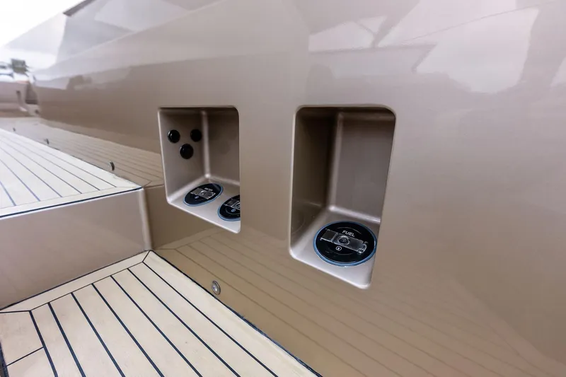 Cobra Yacht Photos Pics 2022 Vanquish Yachts VQ45 fuel cap and controls on sleek deck.