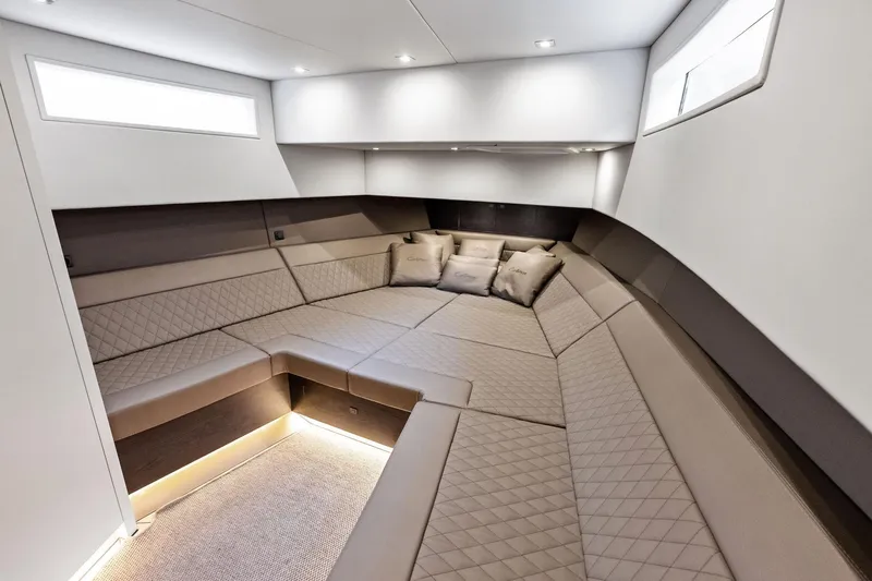 Cobra Yacht Photos Pics Luxurious interior of 2022 Vanquish Yachts VQ45 with elegant seating and ambient lighting.