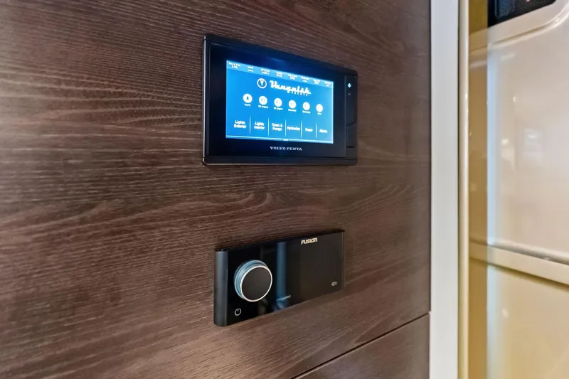 Cobra Yacht Photos Pics Control panel on 2022 Vanquish Yachts VQ45, featuring touchscreen and audio system.