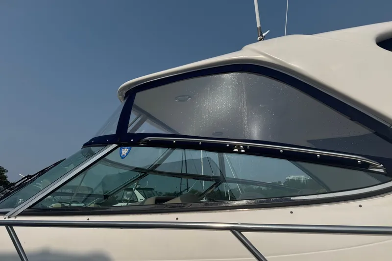 Rose Yacht Photos Pics Close-up of 2001 Sea Ray 540 Sundancer yacht's sleek windshield design.