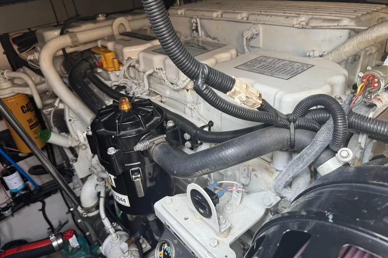 Rose Yacht Photos Pics Engine compartment of a 2001 Sea Ray 540 Sundancer, showcasing detailed mechanical components.