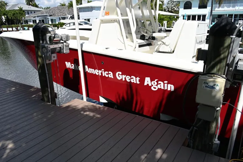  Yacht Photos Pics Red 2016 SeaVee 340Z boat docked, featuring "Make America Great Again" text.
