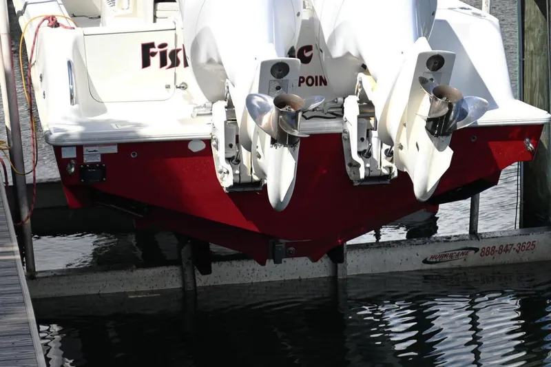  Yacht Photos Pics 2016 SeaVee 340Z boat with dual outboard motors, docked on a lift.