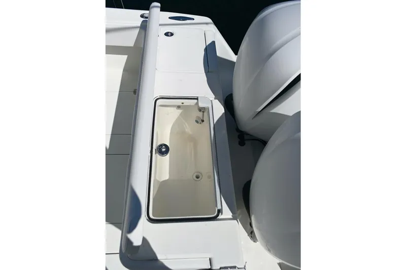  Yacht Photos Pics 2016 SeaVee 340Z boat deck with open storage compartment and dual engines.