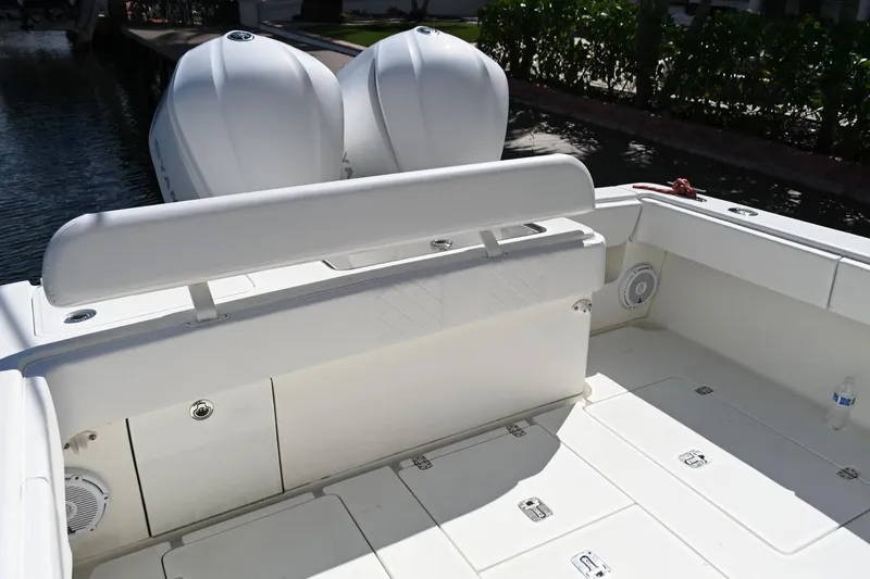  Yacht Photos Pics 2016 SeaVee 340Z boat deck with twin engines, featuring spacious seating and storage.
