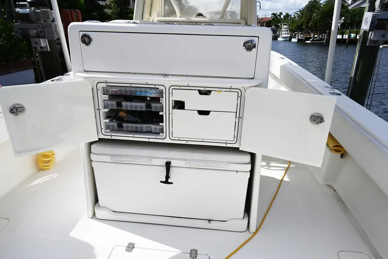  Yacht Photos Pics 2016 SeaVee 340Z boat storage compartments open, showcasing organized fishing gear.