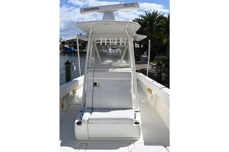  Yacht Photos Pics 2016 SeaVee 340Z boat with Garmin radar, docked by a scenic waterfront.