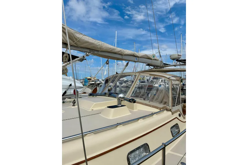  Yacht Photos Pics Sailboat Island Packet 380, 1999 model, docked at marina under blue sky.