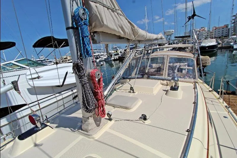  Yacht Photos Pics 1999 Island Packet 380 sailboat docked at marina, showcasing deck and rigging.