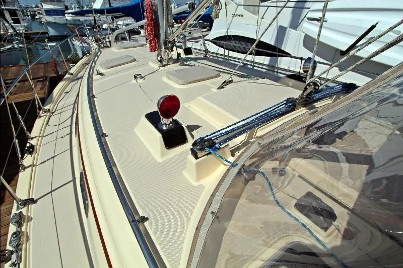  Yacht Photos Pics 1999 Island Packet 380 sailboat deck with rigging and fittings in a marina.