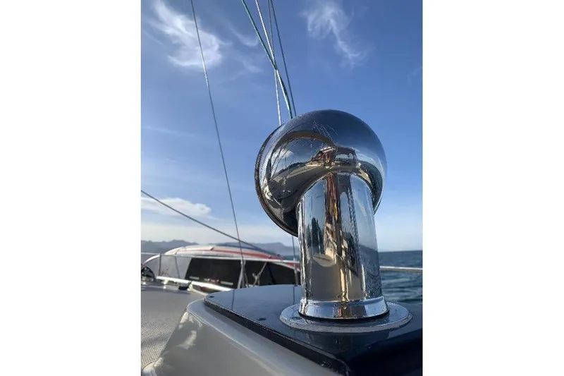  Yacht Photos Pics Chrome fitting on 1999 Island Packet 380 sailboat against clear blue sky.
