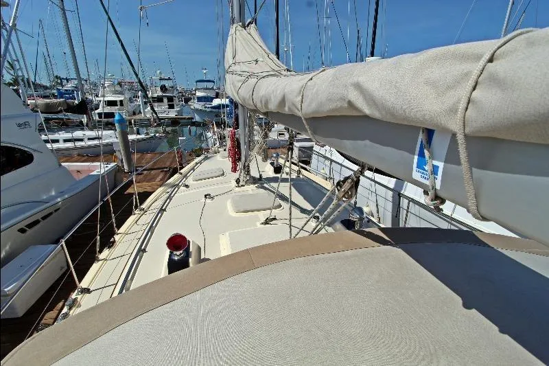  Yacht Photos Pics Sailboat Island Packet 380, 1999 model, docked in a marina with clear blue skies.