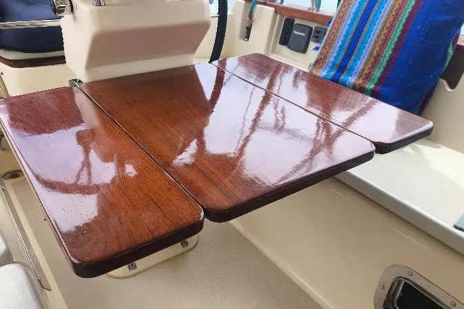  Yacht Photos Pics Polished wooden table on 1999 Island Packet 380 sailboat deck.