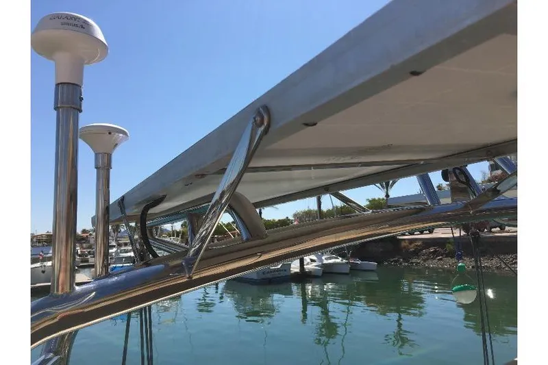  Yacht Photos Pics 1999 Island Packet 380 sailboat with stainless steel rigging and marina backdrop.