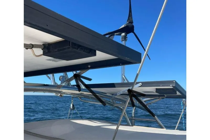  Yacht Photos Pics Solar panels and wind turbine on a 1999 Island Packet 380 sailboat.