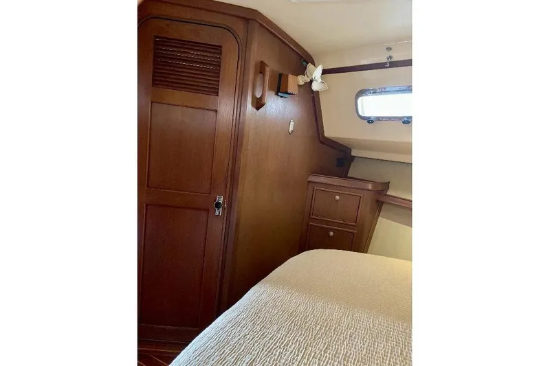  Yacht Photos Pics Interior cabin of 1999 Island Packet 380 sailboat with wooden furnishings.