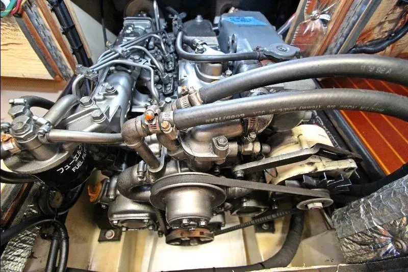  Yacht Photos Pics Engine compartment of a 1999 Island Packet 380 sailboat, showcasing detailed mechanical components.