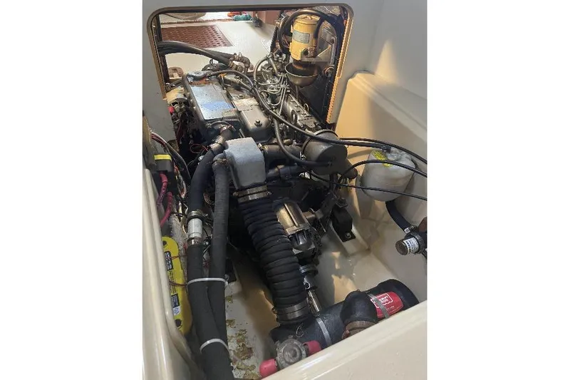  Yacht Photos Pics Engine compartment of a 1999 Island Packet 380 sailboat, showcasing mechanical components.