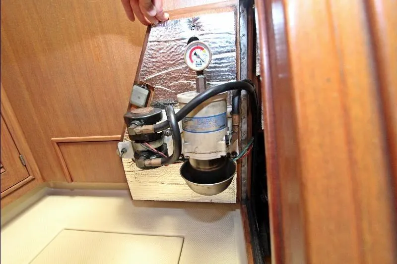  Yacht Photos Pics Engine compartment of a 1999 Island Packet 380 sailboat, showcasing mechanical components.