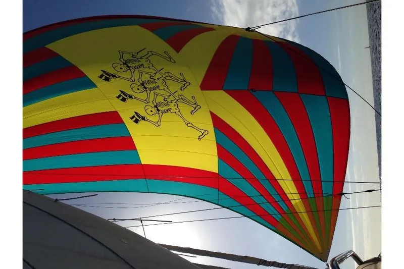  Yacht Photos Pics Colorful spinnaker sail with skeleton design on 1999 Island Packet 380 yacht.