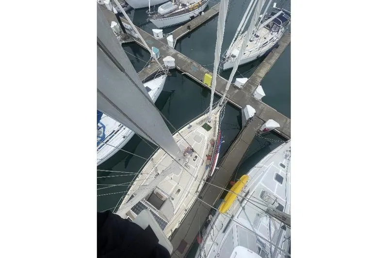  Yacht Photos Pics Aerial view of 1999 Island Packet 380 sailboat docked in a marina.