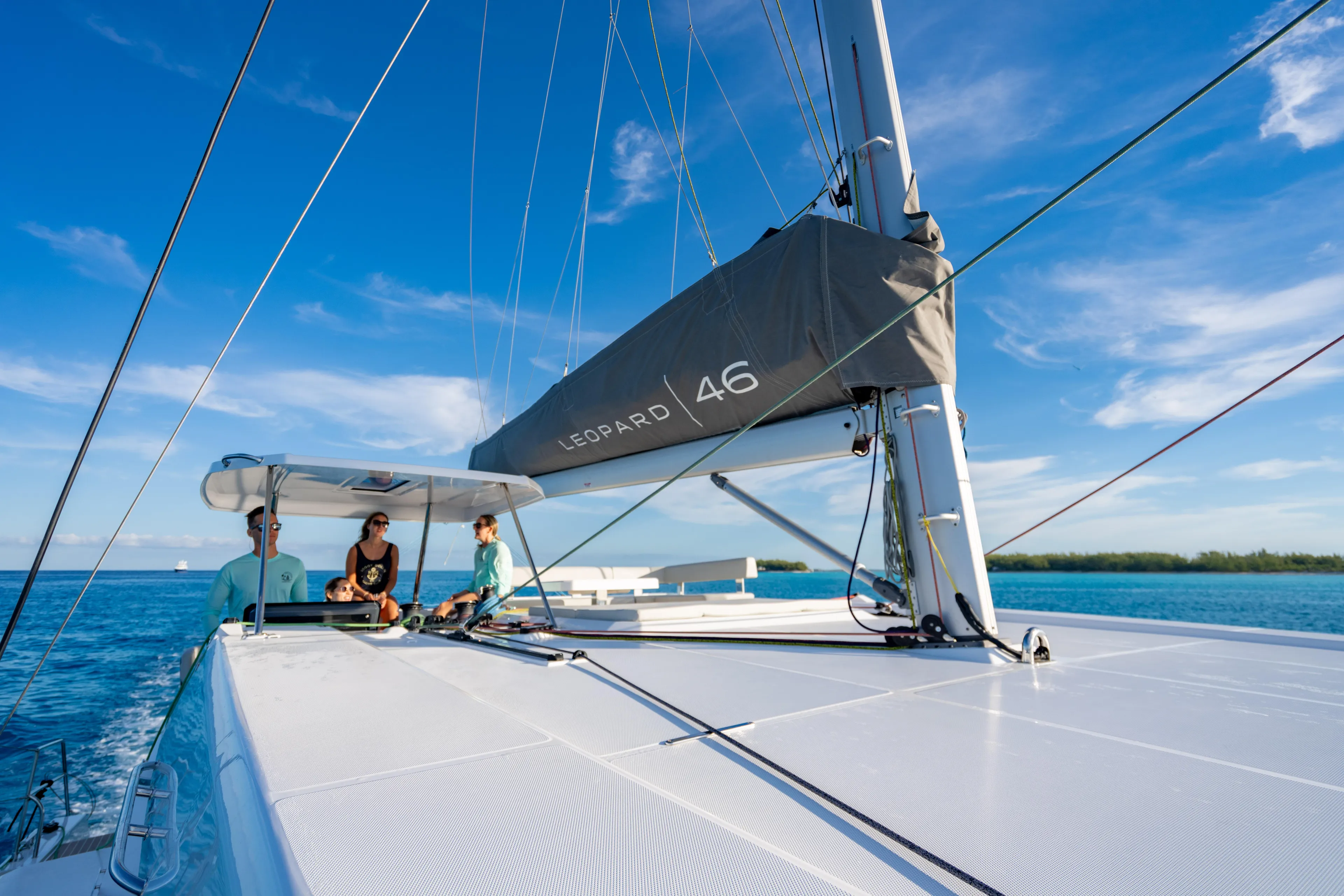 C1019 Yacht Photos Pics Sailing on a 2025 Leopard 46 catamaran under clear blue skies.