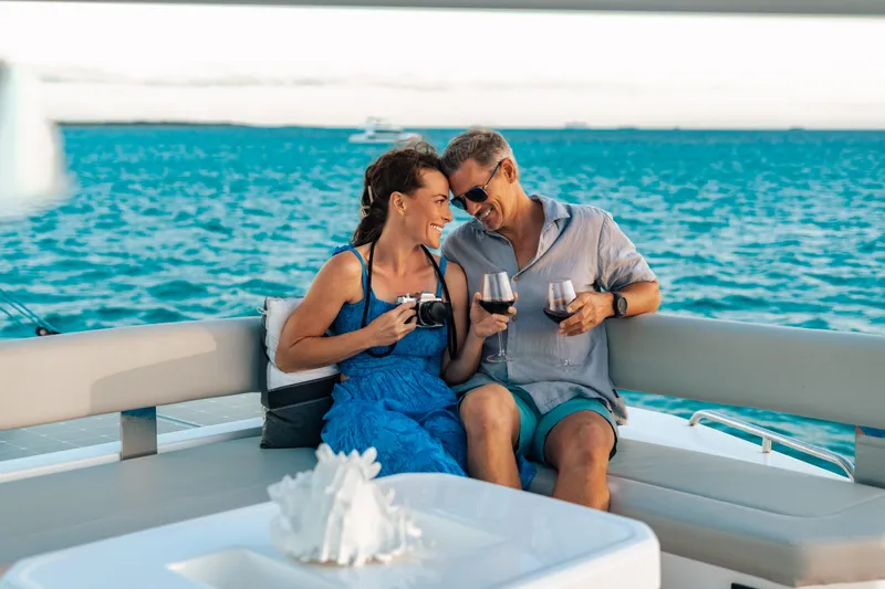 C1019 Yacht Photos Pics Couple enjoying wine on a Leopard 46 yacht, 2025, with ocean view.