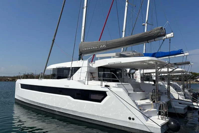 C1019 Yacht Photos Pics 2025 Leopard 46 catamaran docked in a marina, showcasing sleek design and modern features.