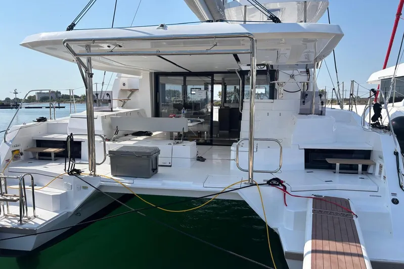 C1019 Yacht Photos Pics 2025 Leopard 46 yacht, spacious deck, modern design, docked at marina.