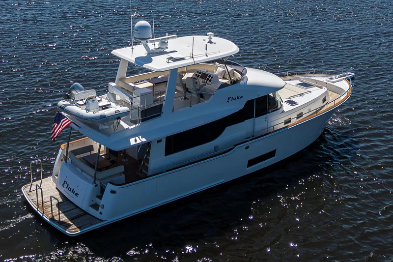 Fluke Yacht Photos Pics 2020 Kadey-Krogen 54 Summit Motoryacht cruising on open water.
