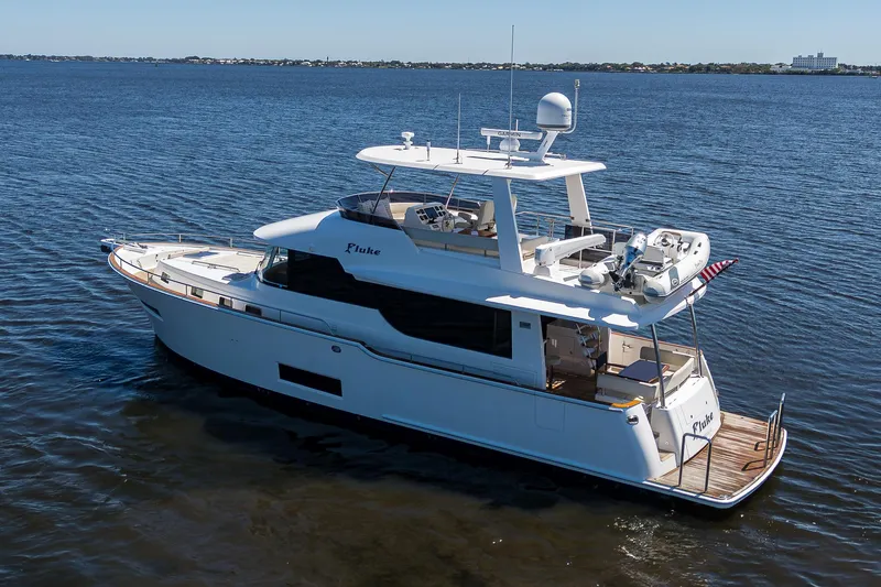 Fluke Yacht Photos Pics 2020 Kadey-Krogen 54 Summit Motoryacht cruising on open water.