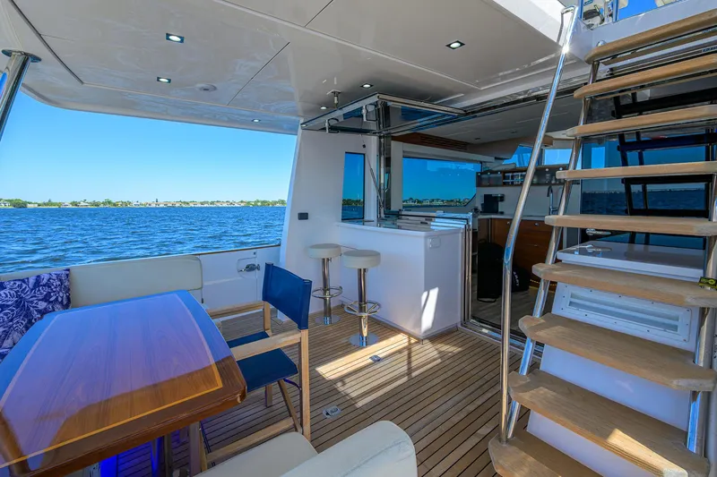 Fluke Yacht Photos Pics Luxurious 2020 Kadey-Krogen 54 Summit Motoryacht interior with elegant seating and scenic ocean view.