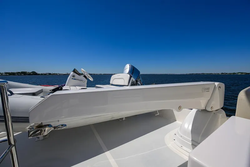 Fluke Yacht Photos Pics 2020 Kadey-Krogen 54 Summit Motoryacht deck with davit, overlooking serene waters.