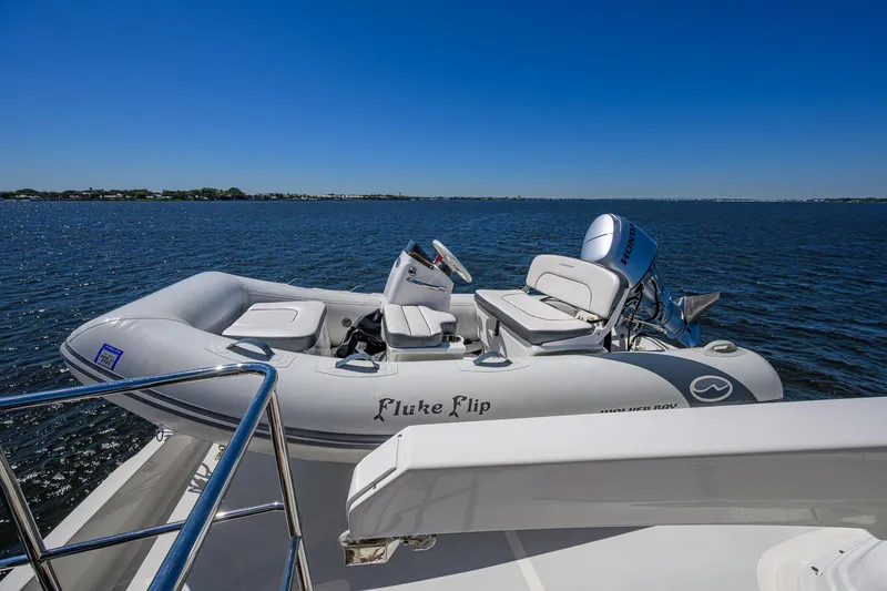 Fluke Yacht Photos Pics Inflatable boat on Kadey-Krogen 54 Summit Motoryacht, 2020, with ocean backdrop.