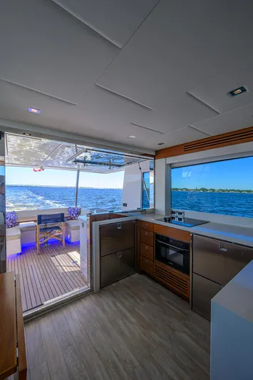 Fluke Yacht Photos Pics Modern kitchen interior of 2020 Kadey-Krogen 54 Summit Motoryacht with ocean view.