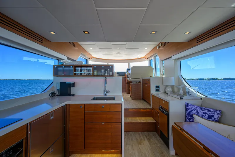 Fluke Yacht Photos Pics Luxurious interior of 2020 Kadey-Krogen 54 Summit Motoryacht with panoramic ocean views.