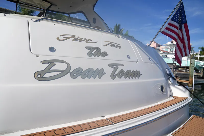  Yacht Photos Pics Sea Ray 510 Sundancer 2001 yacht with "The Dean Team" name, docked with American flag.