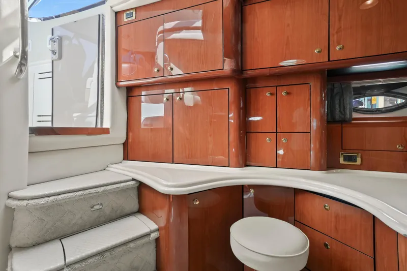  Yacht Photos Pics Luxurious interior of 2001 Sea Ray 510 Sundancer with polished wood cabinetry and plush seating.