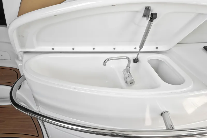  Yacht Photos Pics Sea Ray 510 Sundancer 2001 yacht sink with open lid and faucet.