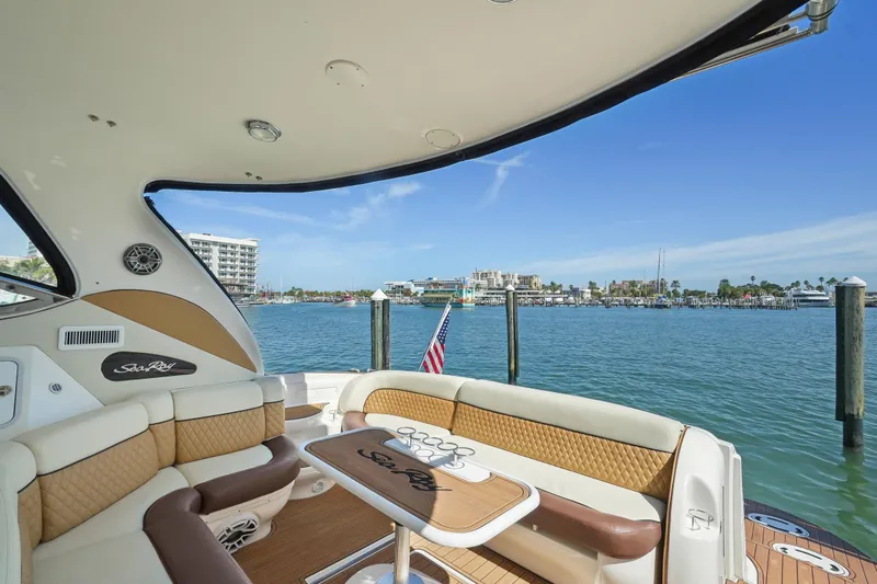  Yacht Photos Pics Sea Ray 510 Sundancer 2001 yacht interior with waterfront view and American flag.