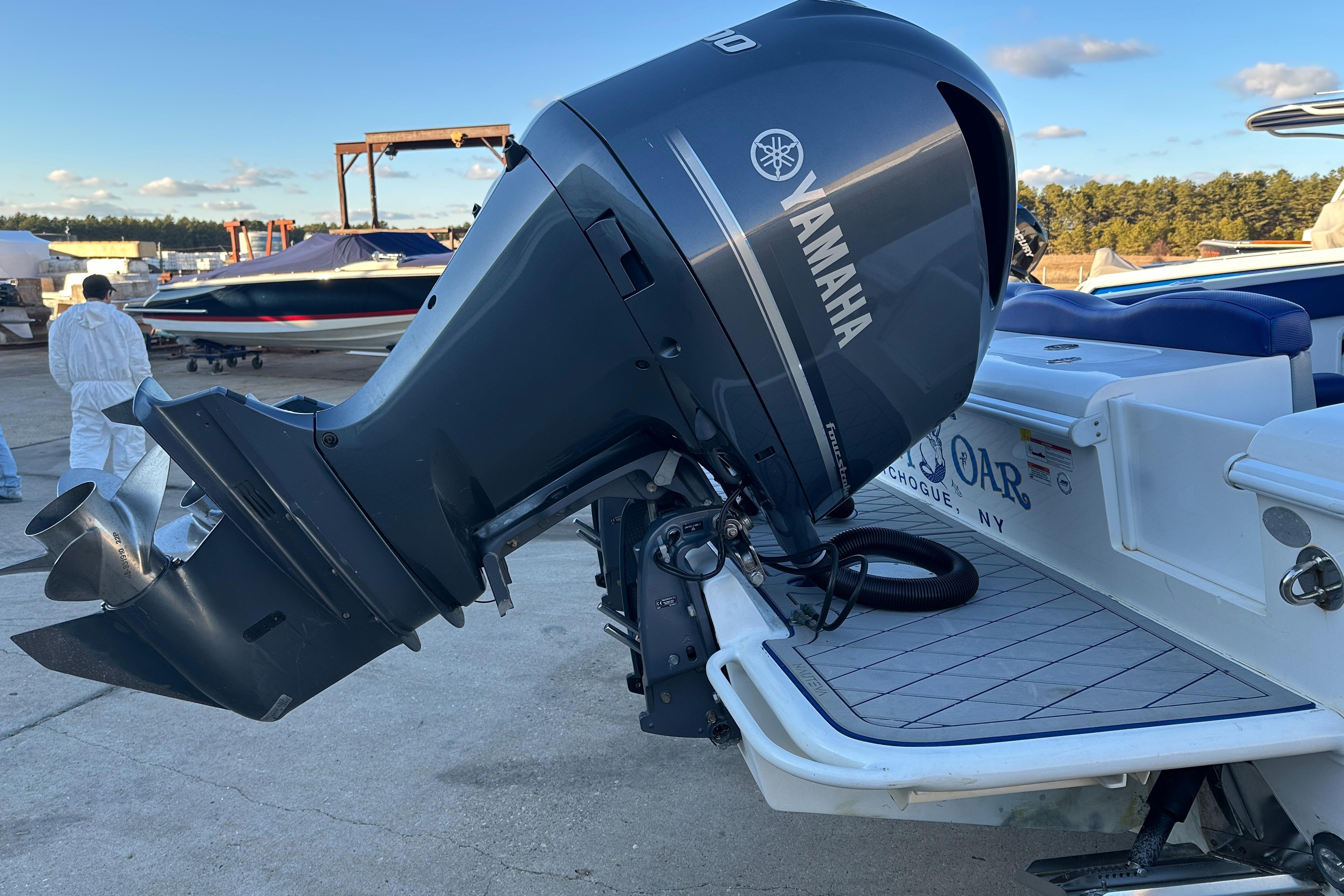 Yamaha outboard motor on 2014 Concept 36 boat, docked outdoors.