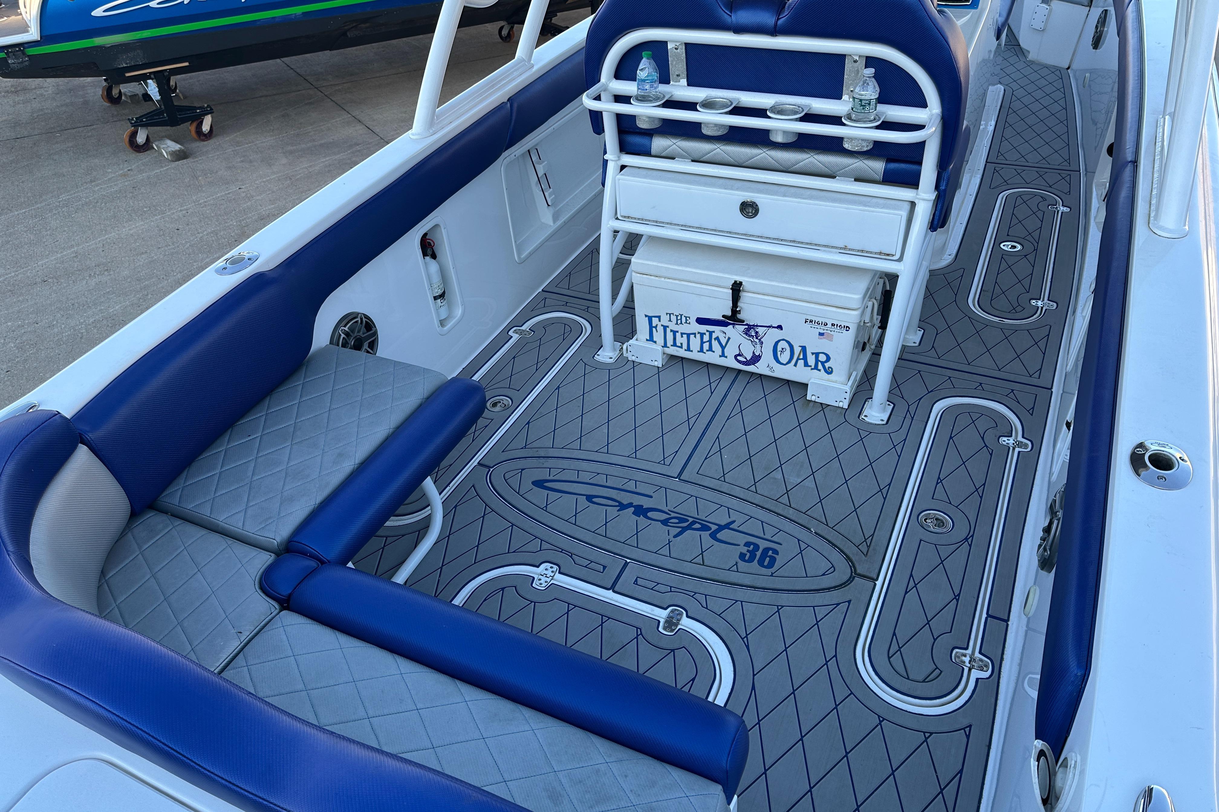 Concept 36 boat interior, 2014 model, featuring blue seating and custom flooring design.