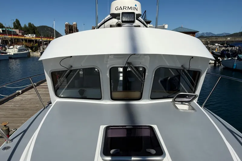 Hardy Yacht Photos Pics 2020 Coastal Craft 33 ProFish boat docked at a marina, featuring Garmin equipment.