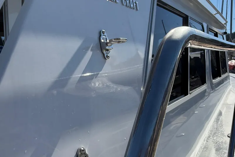 Hardy Yacht Photos Pics 2020 Coastal Craft 33 ProFish boat exterior with sleek design and stainless steel railing.