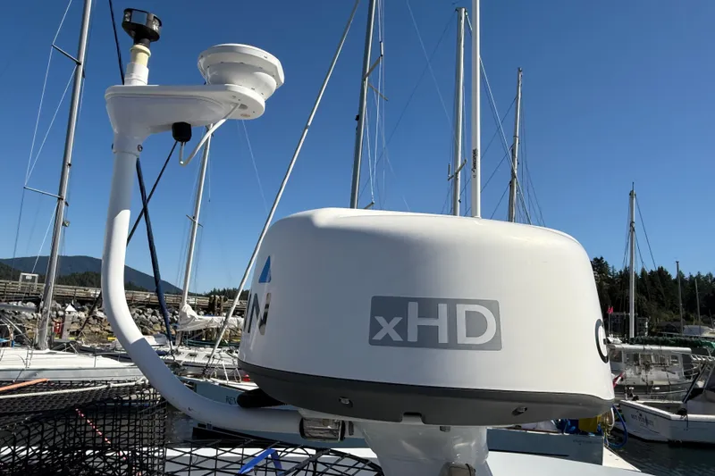 Hardy Yacht Photos Pics 2020 Coastal Craft 33 ProFish with xHD radar, docked at marina under clear blue sky.